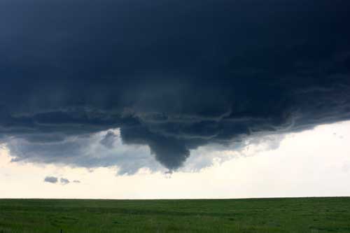 funnel cloud over field
