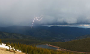 Lightning from the mountain storm that spun the tornado